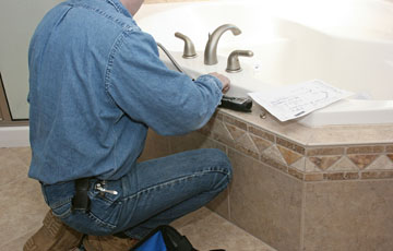 Denver plumber installs brushed alluminum fixtures